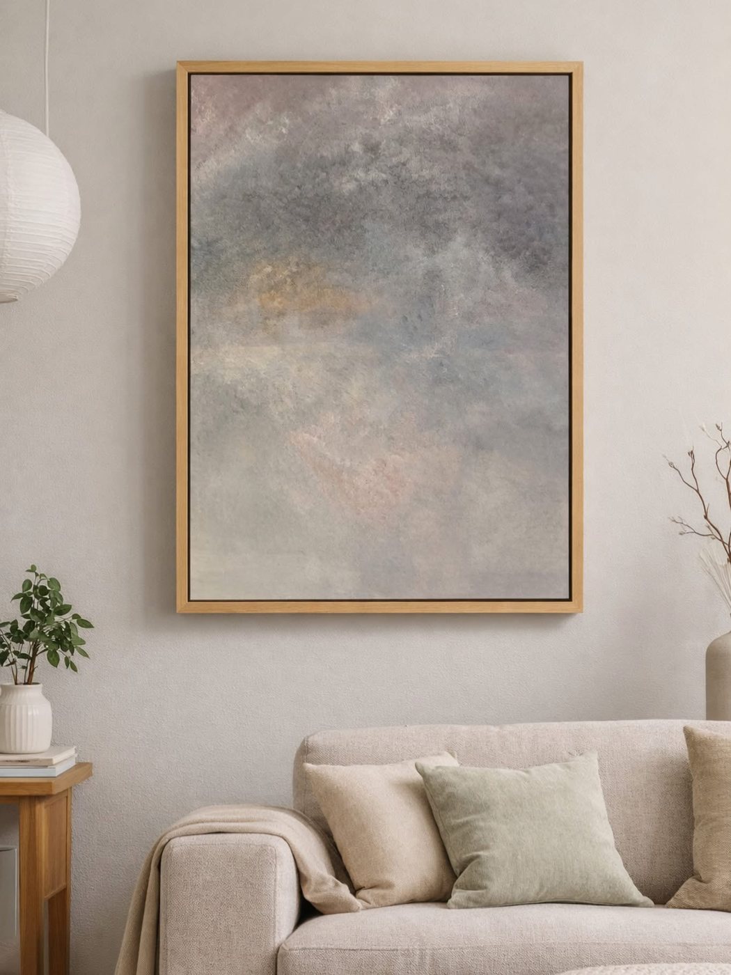 Soft Storm, a cloudscape by Lizette Uys, hanging above a sofa